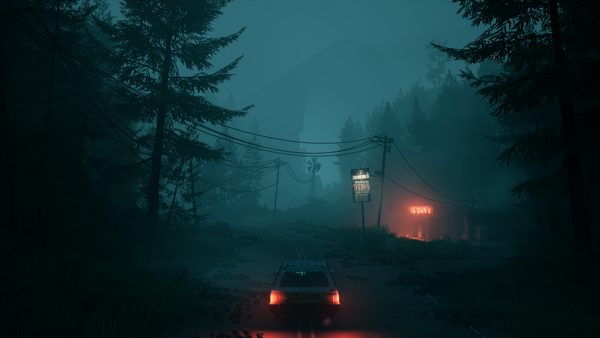 Pacific Drive (2024) screenshot. Dark and foggy view of a road. Car is shown from behind. A gas station sign in the distance ominously illuminates the fog.